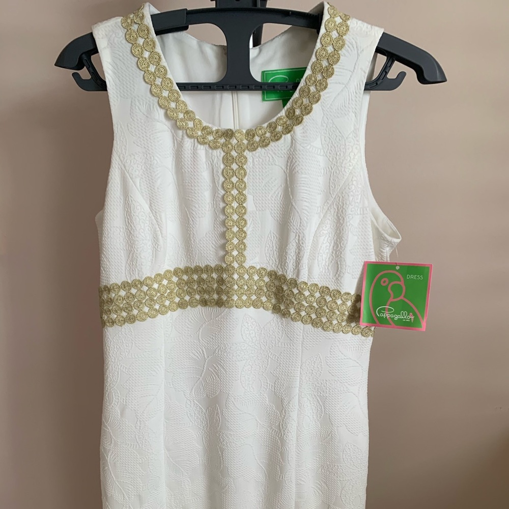 White and gold sleeveless dress above knee length